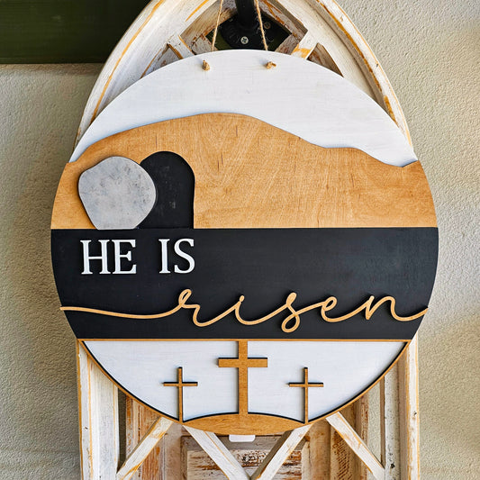 He is Risen round wood sign