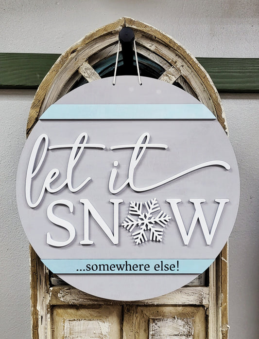 Snow Somewhere Else round wood layered sign