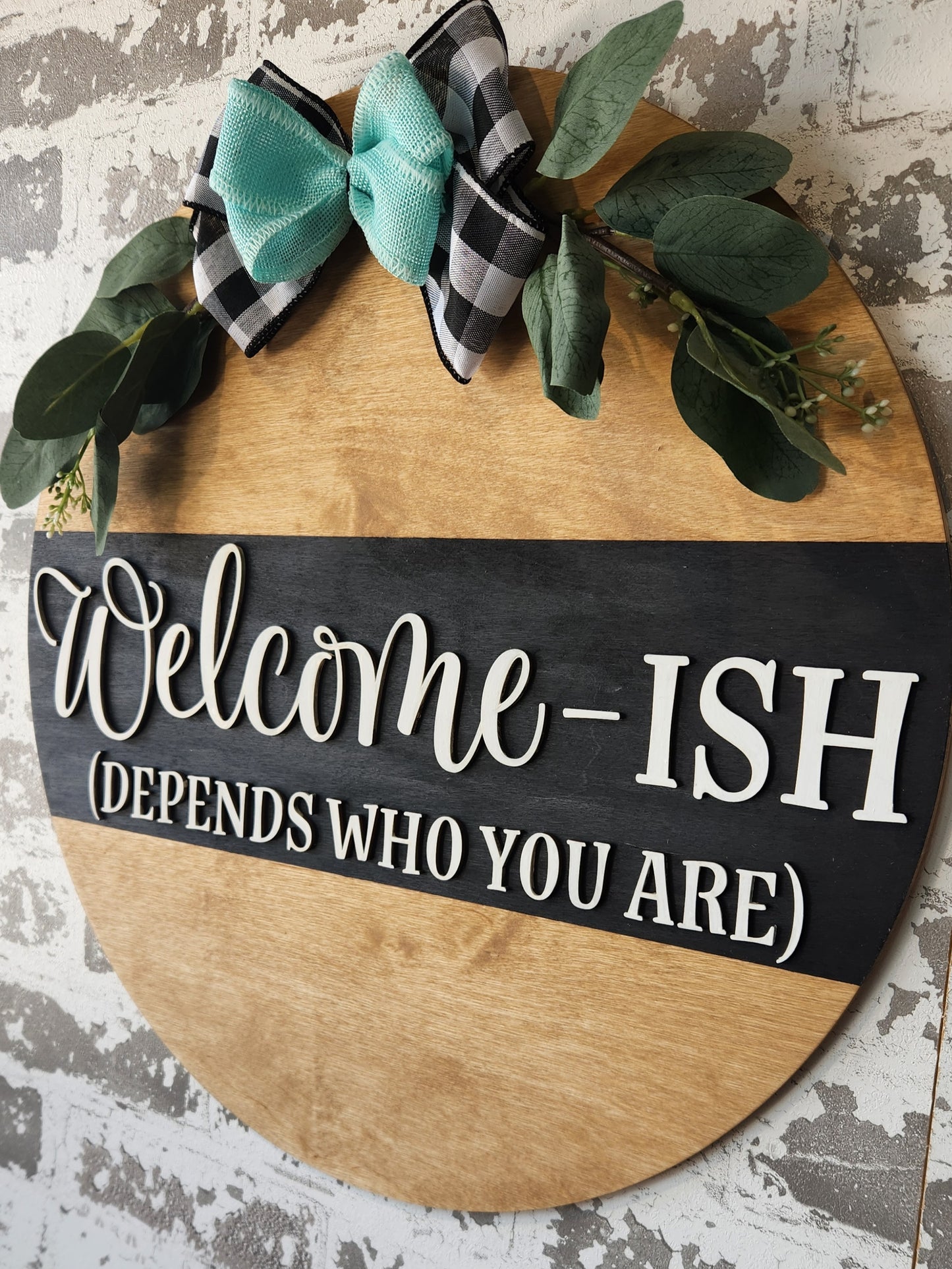 Welcome-ish round wood sign