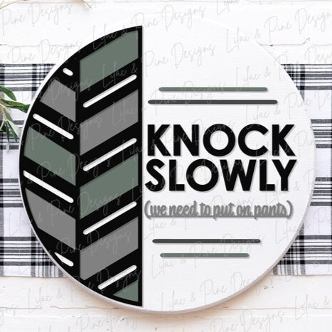 Knock slowly round wood sign